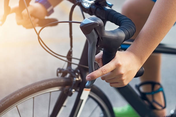 istock closeup hands and handlebar of a young biker on street 521008052