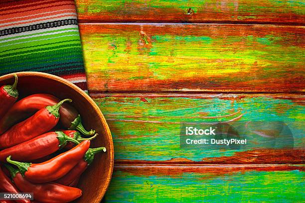 Bowl Of Red Chili Peppers On Vibrant Background Stock Photo - Download Image Now - Mexican Food, Mexican Culture, Tablecloth