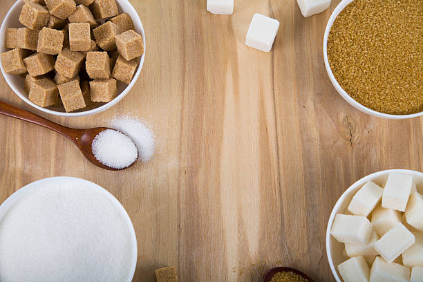 istock Cane and white sugar in a white bowls 521009112