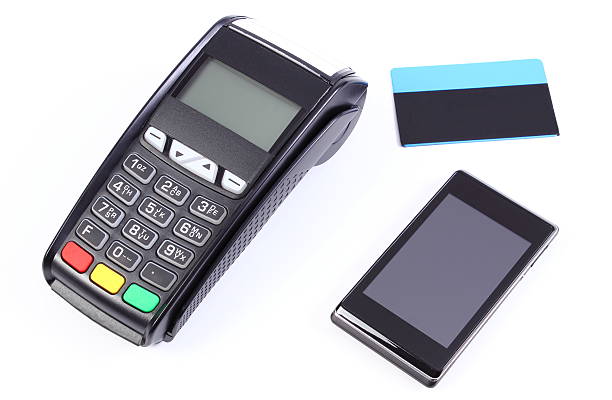 istock Payment terminal, mobile phone with NFC technology and credit card 521013930