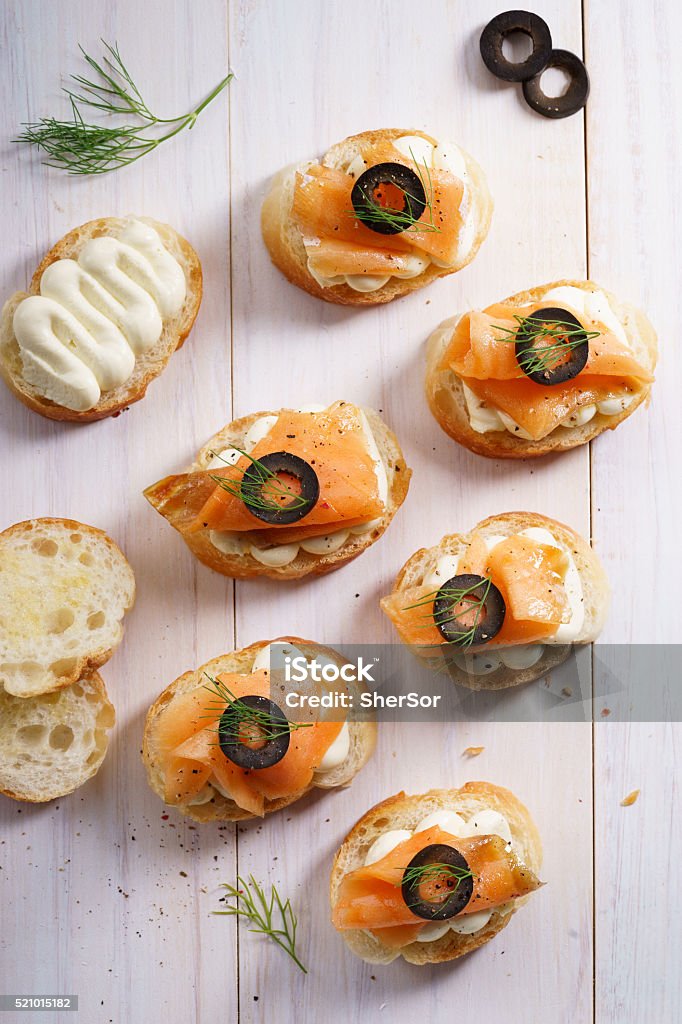 Smoked salmon canape Smoked Salmon and Cream Cheese CanapÃ©sSmoked Salmon and Cream Cheese Canape Biting Stock Photo