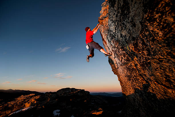 istock Rock climbing up a steep cliff 521022605