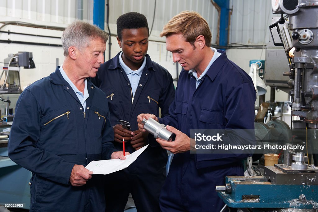 Team Of Engineers Having Discussion In Factory Education Training Class Stock Photo