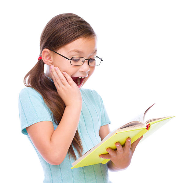 istock Cute girl is reading book 521024243