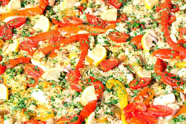 istock Valencian paella with seafood and tomato peppers 521028649