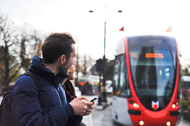 istock two friends waiting for the tram 521029197