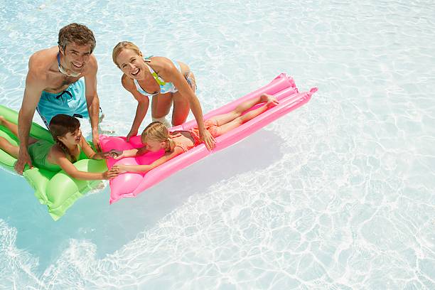 istock Family playing in a wading pool 521033542