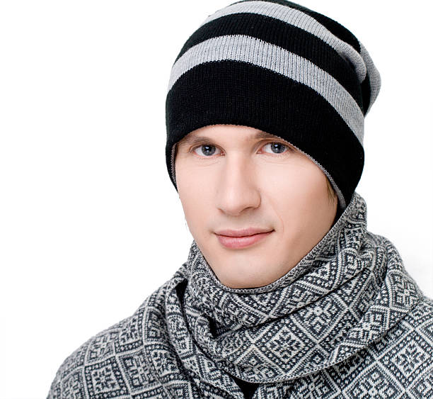 istock Young man in scarf and hat 521033780