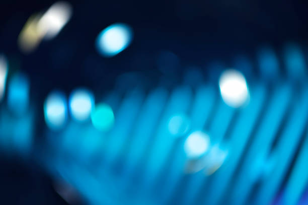 istock Defocused light and shadow of light bulb, blue tone, abstract background 521039788