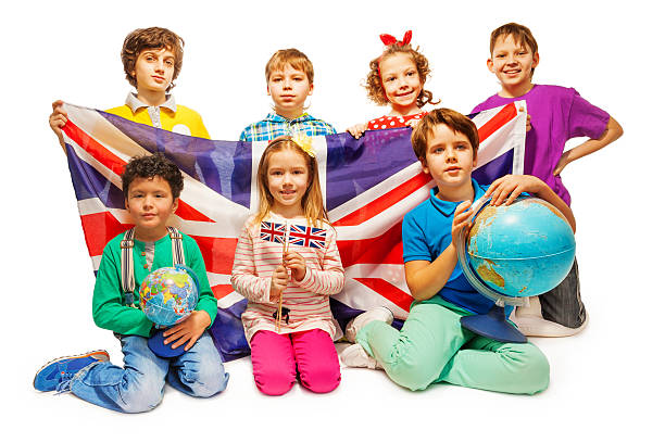istock Group of seven kids studying geography with globes 521041264