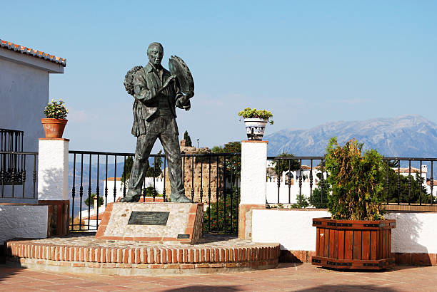 Comares, Spain - June 29, 2008: Balcony with statue of Antonio Miguel Gallego Romero in the foreground, Comares, Malaga Province, Andalusia, Spain, Western Europe.