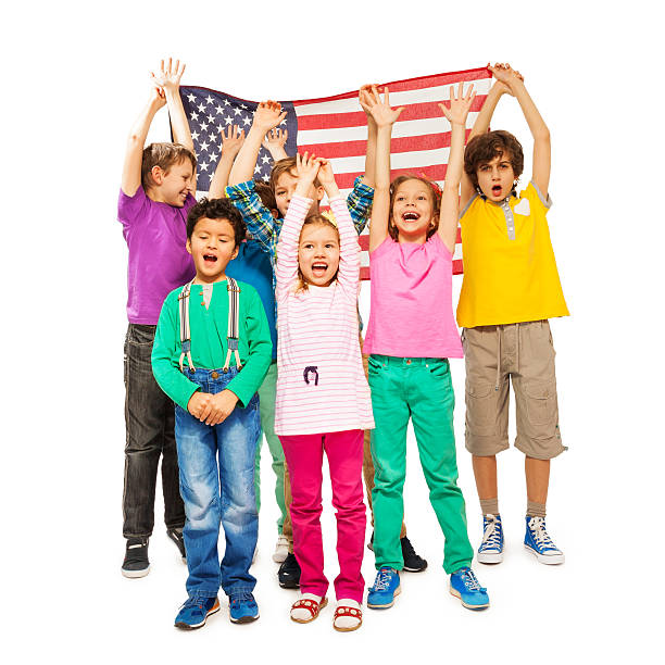 istock Group of children enveloped under American flag 521042062