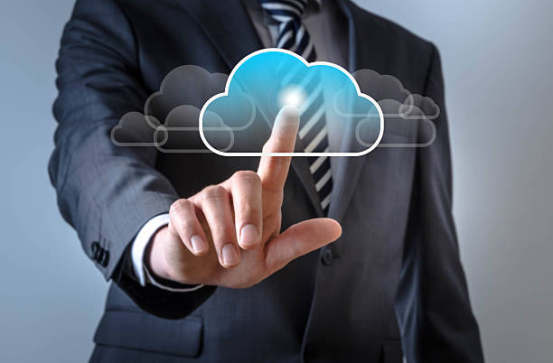 istock Business man touches a screen with a cloud symbol 521042868