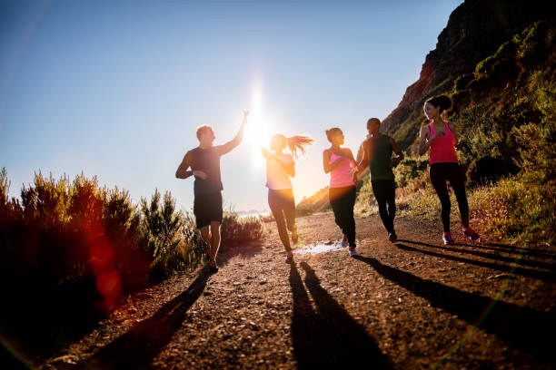 Cheerful friends running outdoors