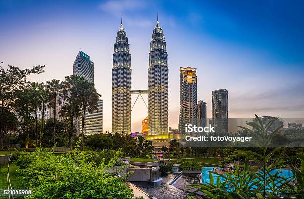 Kuala Lumpur Klcc Park Petronas Towers Illuminated At Sunset Malaysia Stock Photo - Download Image Now