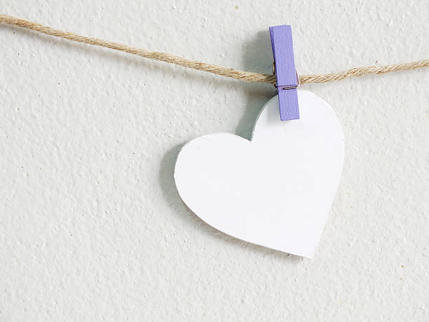 istock heart symbol hanging wit rope 521045988