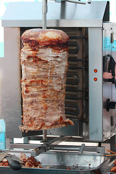 istock Kebab meat cooked in the special vertical furnace 521047453