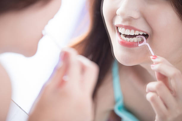 istock Smile woman with teeth floss 521047666