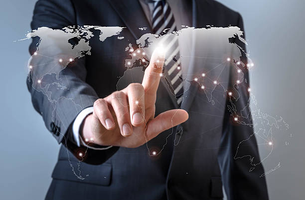 istock Business man touches a screen with connections world map 521048244