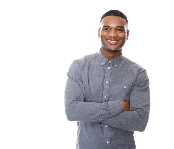istock Modern young black man smiling with arms crossed 521048755