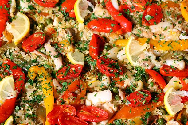 istock Valencian paella with seafood and tomato peppers 521049703