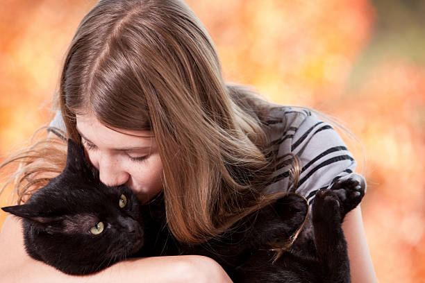 istock Young Girl Hugging And Kissing Her Kitty Cat 521069875