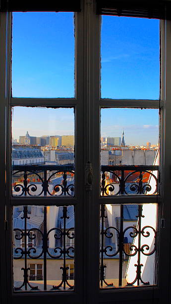 istock Window with a Skyline of Paris with roofs 521070897