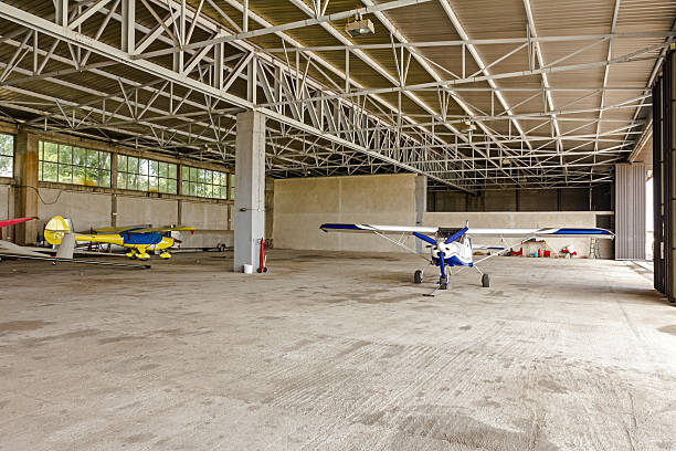istock Airplane is parked in the hangar 521071487