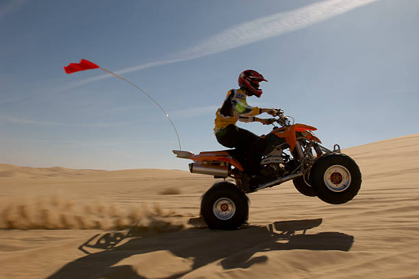 istock Man Riding Quadbike In Desert 521071809