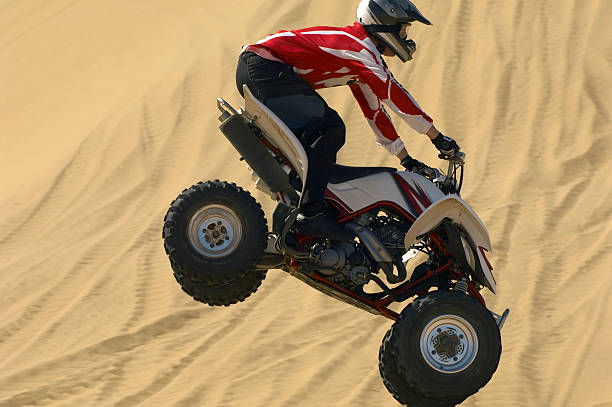 istock Man Riding Quadbike In Desert 521071813