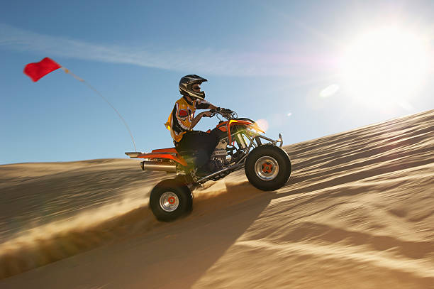istock Man Riding Quadbike In Desert 521071823