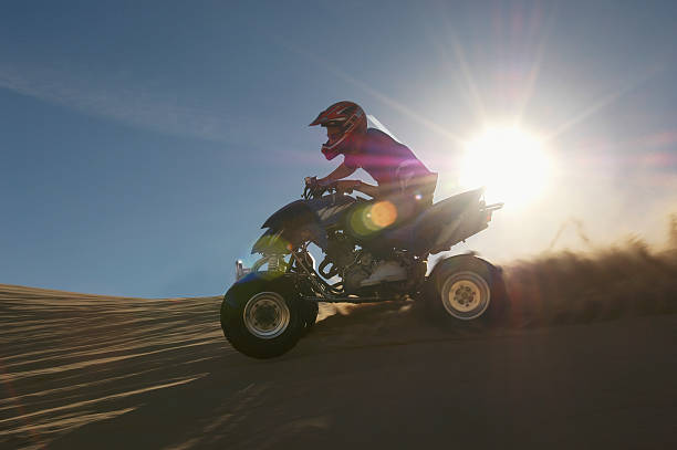 istock Man Riding Quadbike In Desert 521071831