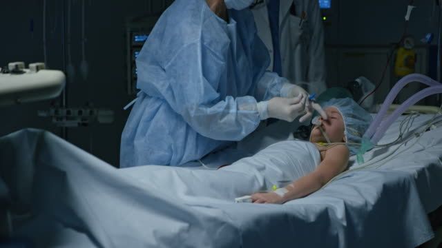 DS Surgeon preparing the mechanical ventilation for a child patient