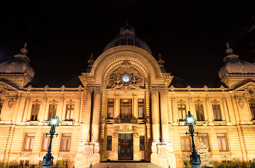 Old bank building at night in Bucharest, Romania. (CEC Palace)