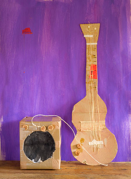 grungy cardboard guitar w. amplifer, free copy space