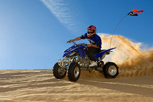 istock Man Riding Quad Bike In Desert 521075543