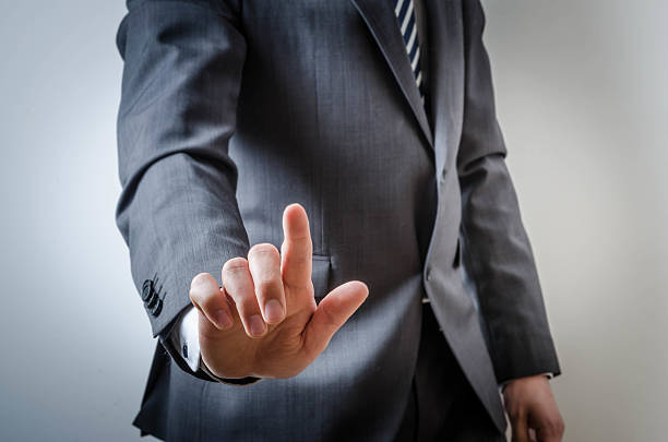 istock Business man shows his index finger 521075634