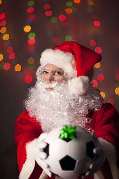 istock Santa Claus Holding A Soccer Ball 521077157