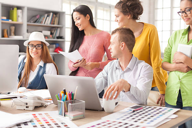 istock Team of creative professionals discussing their ideas at the office 521077644
