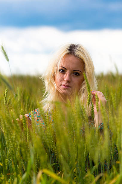 istock Attractive young woman in rye field 521078136