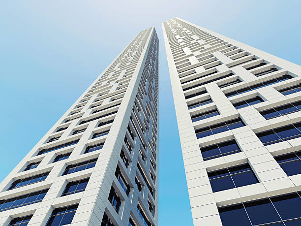 istock Two white office towers perspective on blue sky 521078188