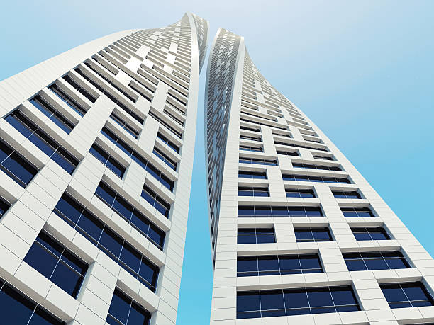 Two twisted towers over blue sky. 3 d