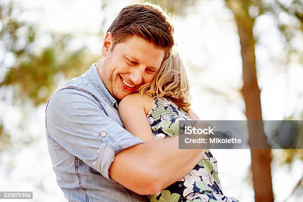 Safe In Daddys Arms Stock Photo - Download Image Now - Adult, Affectionate, Arm Around