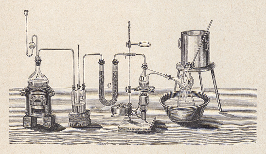 Chemistry laboratory in the past. Wood engraving, published in 1880.