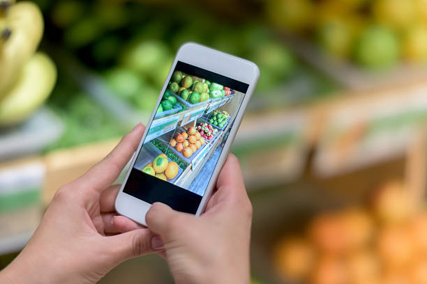istock Using food app on a cell phone at the supermarket 521080148