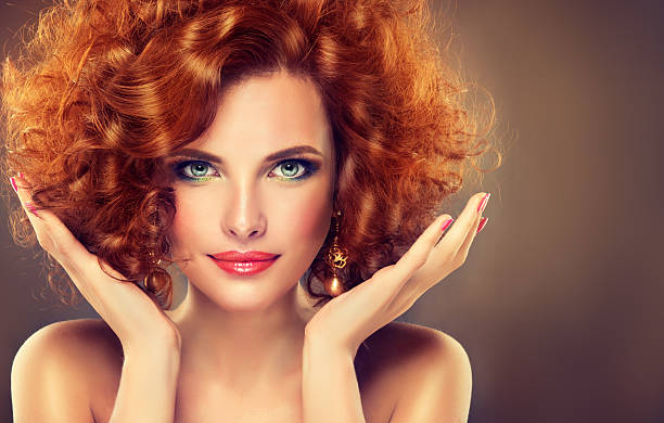 istock Pretty red-haired girl with curls. 521082786