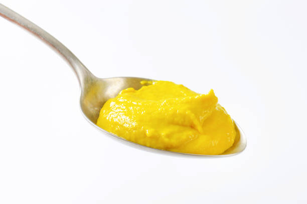 istock Spoonful of yellow mustard 521084300