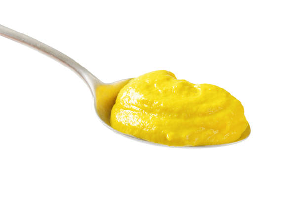 istock Spoonful of yellow mustard 521084322