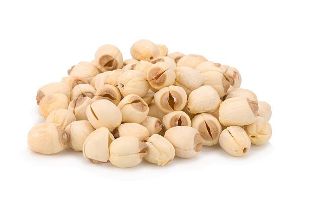 istock Dried lotus seeds on white background 521084890