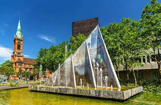 A fountain and the Johannes Church in Dusseldorf, Germany